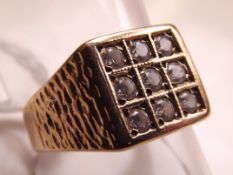 9 carat gold ring set with white stones
