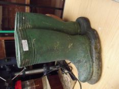 Garden planter in the form of a pair Wellington bo