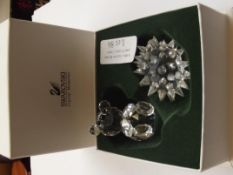 Swarovski teddy bear together with a Swarovski hed
