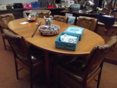 Retro dining table and six leather upholstered cha