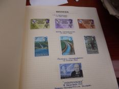 Stamp album with Rhodesian stamps