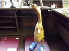 Treen model of a duck modelled in a pair of Crocs