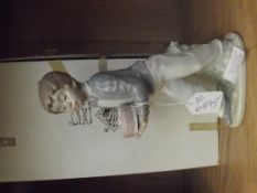 Nao figure of a boy with cake, boxed