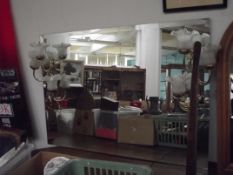 Large bevelled mirror with six brass and frosted g