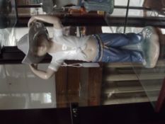 Nao figure of a boy with a cowboy hat