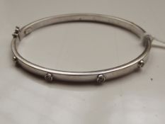 9 ct white gold and diamond bangle, 6 grams