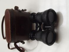 Vintage binoculars in a leather case
