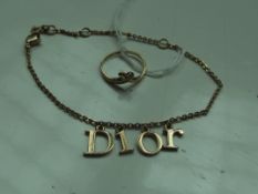 9 ct gold ring together with a yellow metal Dior b