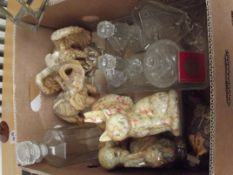Various ceramic figures to include a decanter, a g