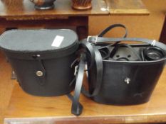 Two pair of cased binoculars