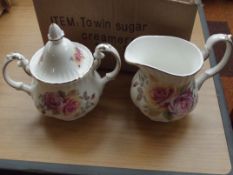 Twin handle sugar bowl and a cream jug