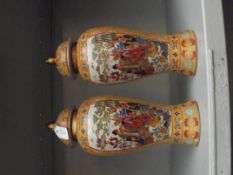 Two oriental lidded temple jars