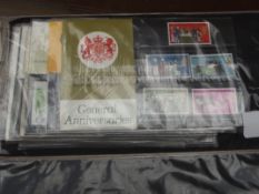 12 presentation packs of stamps