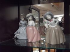 3 Nao figures of young girls
