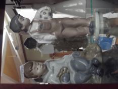 Two Nao figures of young boys