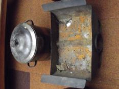 Fire pit together with a lidded twin handled metal