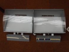 Two express mail storage containers