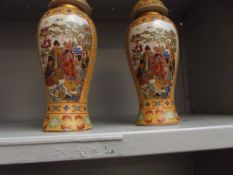 Two Oriental lidded vases