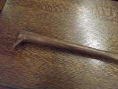 Walking stick with stylised handle in the form of