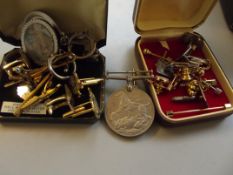 Collection of tie pins and cuff links together wit
