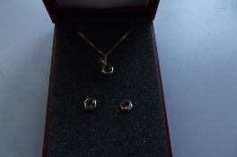 9 carat gold chain with pendant and earrings