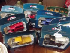 Six Corgi model vans