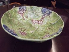 Large fruit bowl decorated in relief with vines an