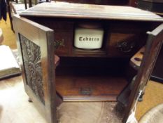 Edwardian oak smokers cabinet with later tobacco b