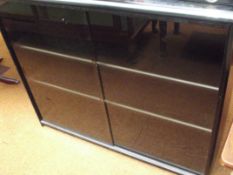 Sliding doors storage unit