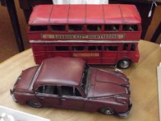 Tin London city bus and one other car