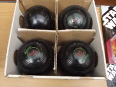 Set of four lawn bowls
