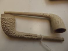 2 clay pipes, one marked Pollocks Manchester