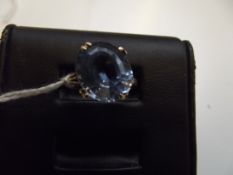 9 ct gold dress ring with large blue gemstone, siz