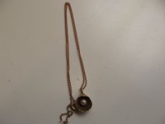 9 ct gold chain and pendant with shell and pearl