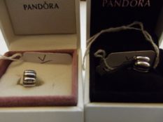 2 Pandora charms, boxed