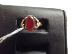 9 ct gold dress ring with orange stone, size N