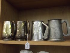 Two pewter tankards and two others.