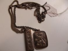 Silver ingot together with a silver pendant with c