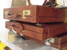 Three leather cases