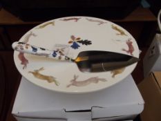 Boxed cake stand and cake knife together with a mi