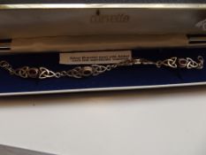 Silver bracelet set with amber stones
