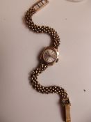 9 ct gold cased watch with 9 ct gold strap, Accuri