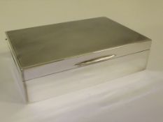 Silver cigarette/cigar box, the hinged lid with en