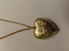 9 carat gold photograph locket, heart form with 9