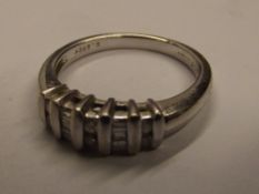 18 carat white gold set with rose-cut and emerald-