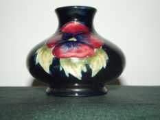 Moorcroft squat vase in the Anemone pattern, impressed and painted marks, height 7cm