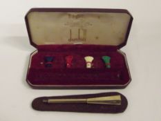 Cased Dunhill 9 carat gold art deco cigarette hold