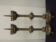 Pair of brass Pugin style Church candlesticks, spiral twist stem and carried on paw feet, height