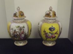 Pair of Continental lidded temple jars, height 30cm