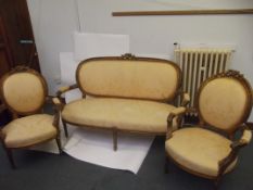 Late 19th century Continental gilt framed suite comprising two open arm chairs and settee